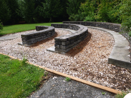 The Learning Center is three semi–circle rows of seating for gatherings up to 20 people - the trail is compacted crushed rock